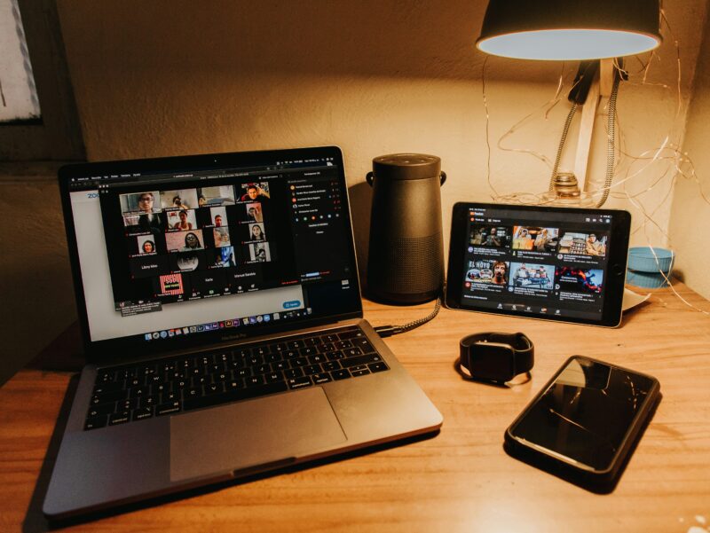 A Zoom online meeting screen. Participants from remote locations are engaged in a discussion. Photo: gabriel-benois-unsplash